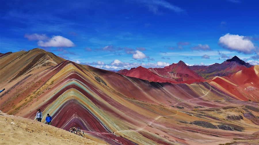 Cusco: Rainbow Mountain Tour with Meals & Red Valley Option - Descending and Eating a Typical Andean Lunch