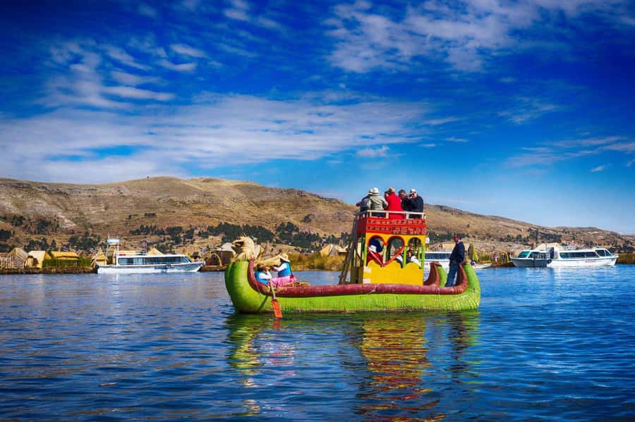 From Cusco: Titicaca Lake - Full day tour with sleeper bus - Crossing Lake Titicaca by speedboat