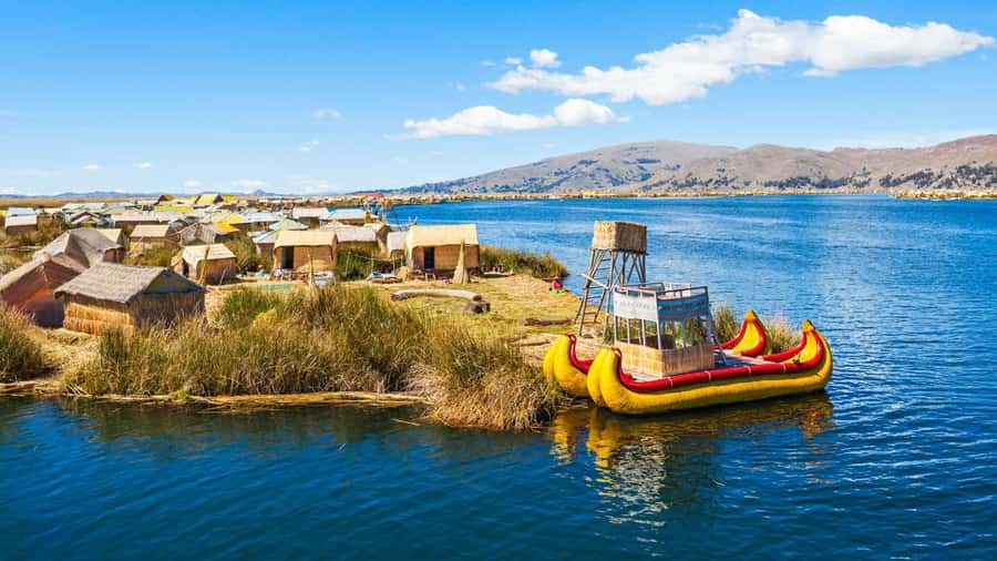 From Cusco: Uros Excursion to Uros Island - Taquile + Lunch. - Boarding the boat in Puno