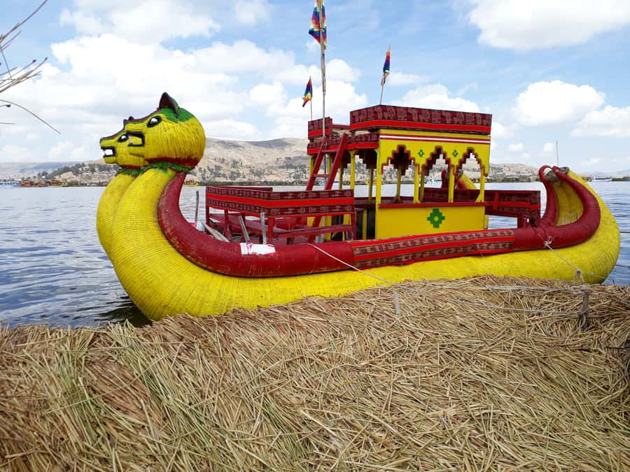 From Puno: Floating Islands of the Uros Half-Day Tour - Walking onto a floating island