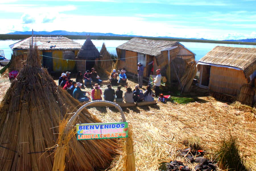 From Puno: Uros floating islands half Day tour - The optional handmade boat ride
