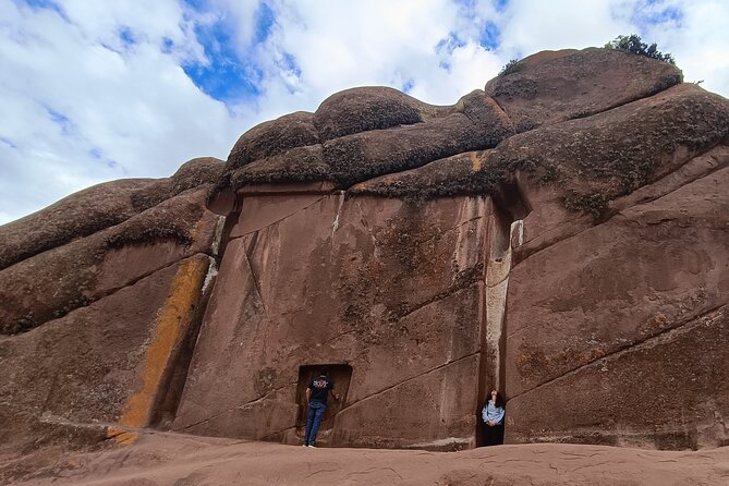 Full Day Guided Tour of the Aymara Route from Puno - Walking among the rocks at Aramu Muru