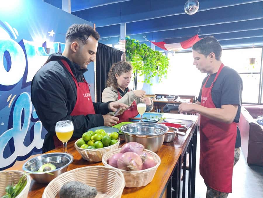 Miraflores: Amazing Peruvian Cooking Class Ceviche Seafood and Pisco Sour - Preparing tuna tartare with fresh fish
