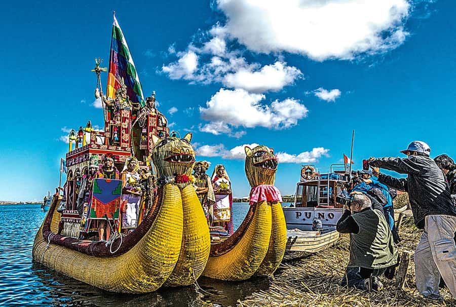 Puno: Uros and Taquile Islands Full-Day Tour with Lunch - Walking across the floating Uros Islands